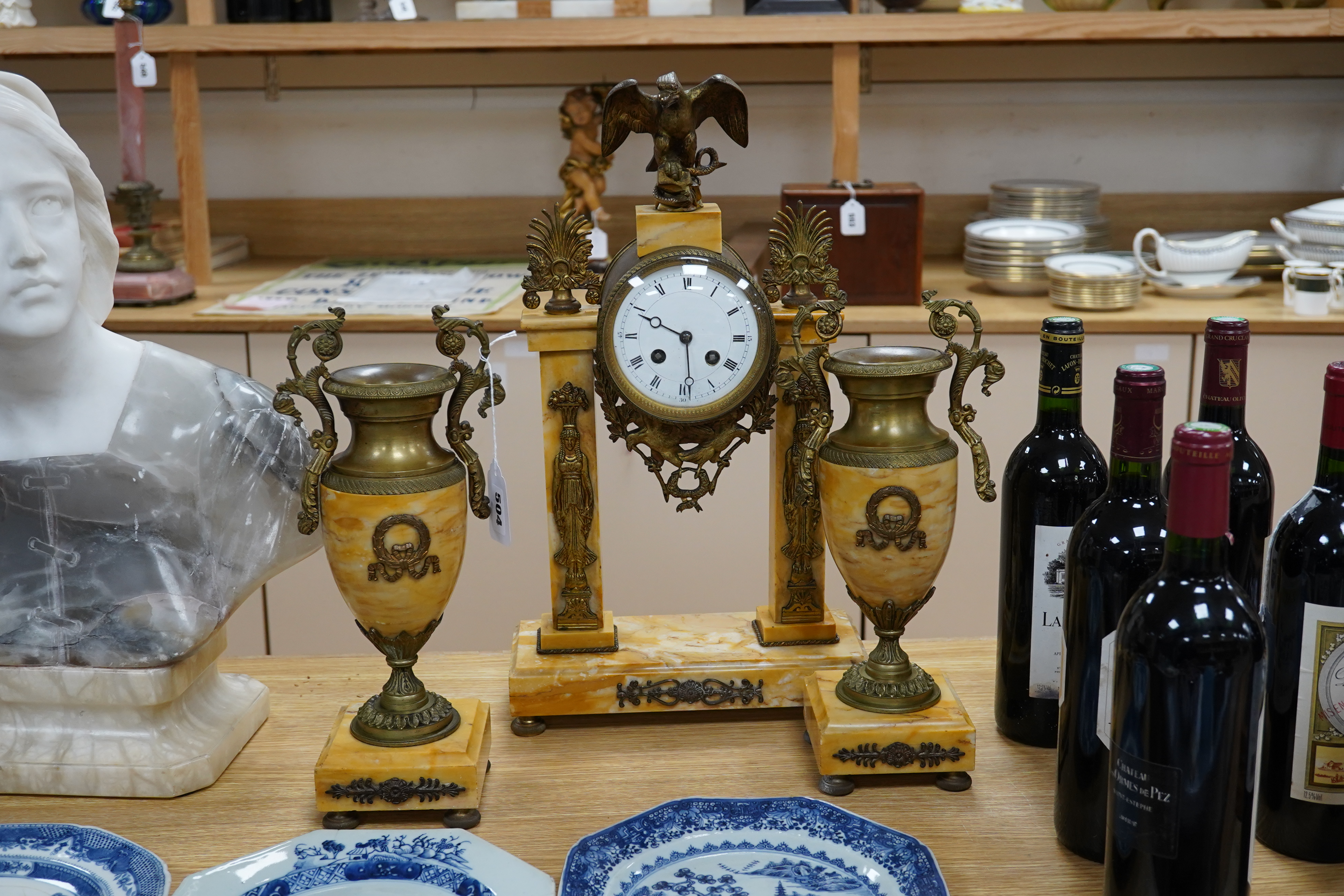 A 19th century French Sienna marble and gilt bronze clock garniture, with eagle surmount to clock, 48cm high. Condition - good